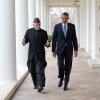 President Barack Obama and President Hamid Karzai of Afghanistan walk on the Colonnade of the White House following their meeting in the Oval Office, January 11, 2013. 