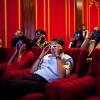 President Barack Obama and First Lady Michelle Obama wear 3-D glasses while watching a TV commercial during Super Bowl 43, Arizona Cardinals vs. Pittsburgh Steelers, in the family theater of the White House on February 1, 2009. Guests included family, fri