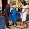 President Barack Obama and First Lady Michelle Obama greet 106-Year-Old Virginia McLaurin during a photo line in the Blue Room of the White House prior to a reception celebrating African American History Month, February 18, 2016. 