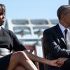 President Barack Obama and First Lady Michelle Obama hold hands as they listen to Rep. John Lewis during an event to commemorate the 50th Anniversary of Bloody Sunday and the Selma to Montgomery civil rights marches, at the Edmund Pettus Bridge in Selma, 