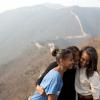 First Lady Michelle Obama hugs daughters Sasha, left, and Malia as they visit the Great Wall of China in Mutianyu, China, March 23, 2014. 