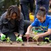 First Lady Michelle Obama joins FoodCorps leaders and local students for the spring planting in the White House Kitchen Garden, April 2, 2014. 