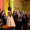 First Lady Michelle Obama and audience members show their appreciation for a performance during the White House Talent Show in the East Room of the White House, May 20, 2014. The event, hosted with the President's Committee on the Arts and the Humanities,