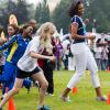 First Lady Michelle Obama runs at an activity station during a 