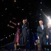 President Barack Obama, First Lady Michelle Obama, daughters Sasha and Malia, Vice President Joe Biden, Dr. Jill Biden, and the Biden family wave to the crowd as confetti rains down following the President's election night remarks at McCormick Place in Ch
