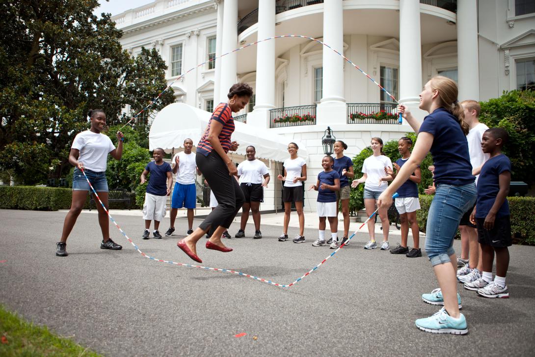 First Lady Michelle Obama and kids double-dutch jump rope during a taping for the Presidential Active Lifestyle Award (PALA) challenge and Nickelodeon's Worldwide Day of Play, on the South Lawn of the White House, July 15, 2011. 